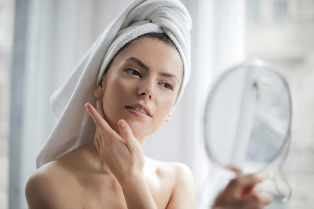 Woman Looking In Mirror